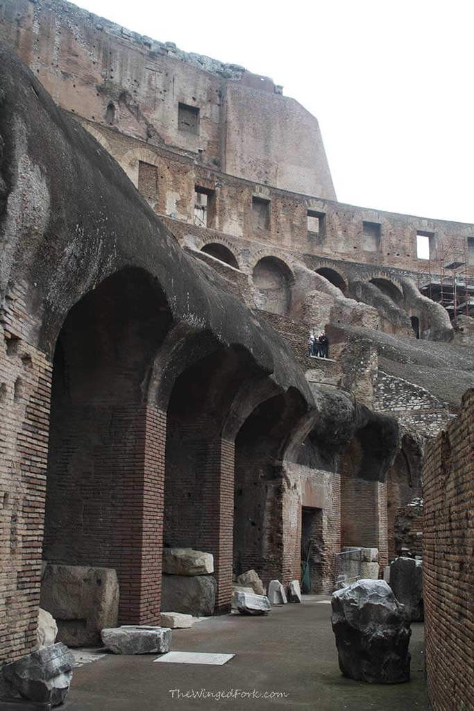 One of the alleyways on the upper levesl of the Colosseum against the backdorp of a clear blue sky