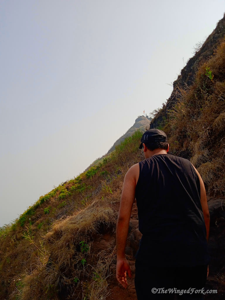 A guy walking towards Tung fort in the distance.