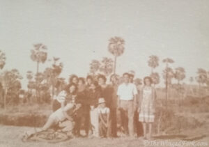 Our parents, grandparents and cousins at the fields with targola trees at the back.