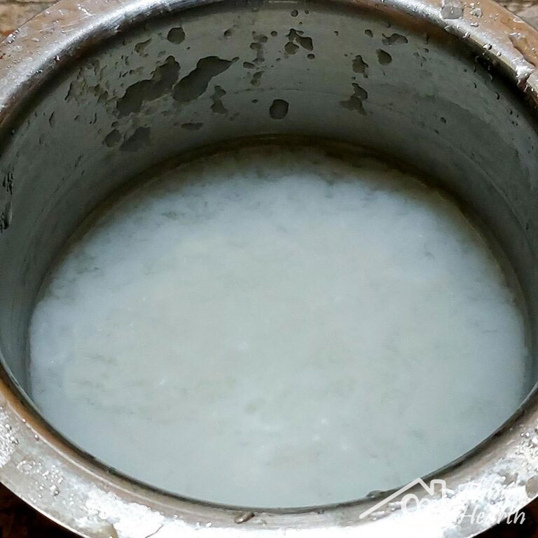 Thickened rice water in a steel bowl.