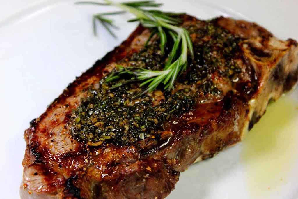 Tender steak is cooked to perfection and served as Kansas City Strip.