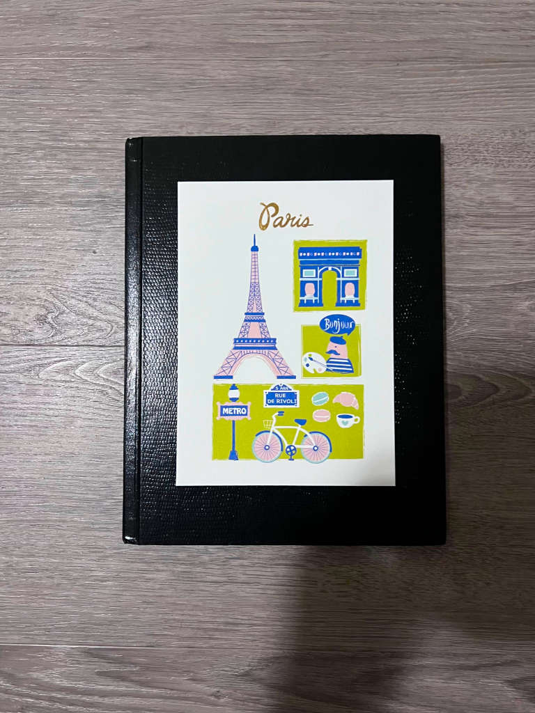 Notebook with Paris design on the cover.