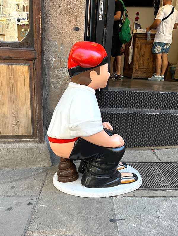 The Caganer figurine is of a man squatting to defecate.