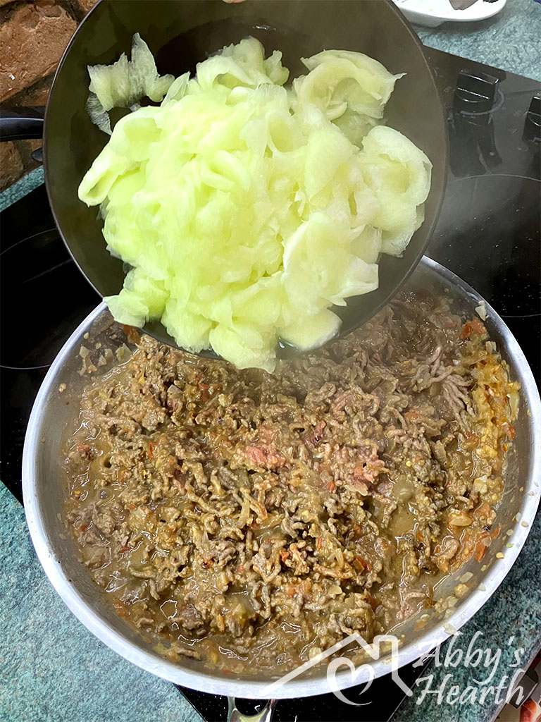 Add boiled cabbage to the cooked mince.