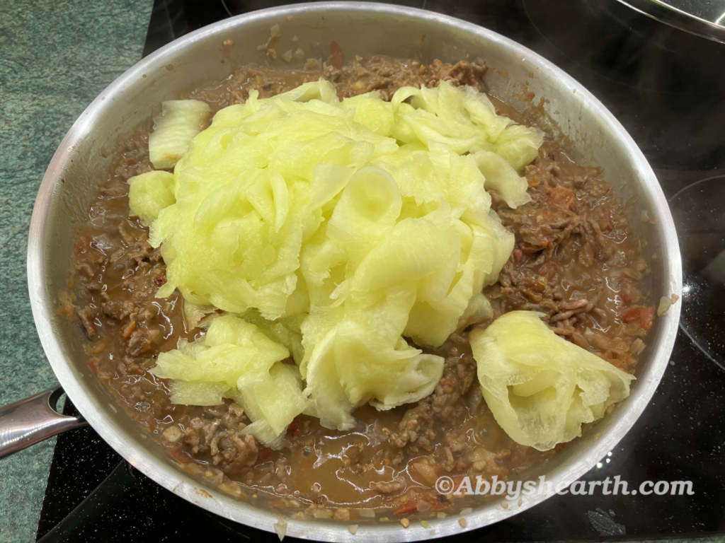 Add boiled cabbage to the cooked mince.