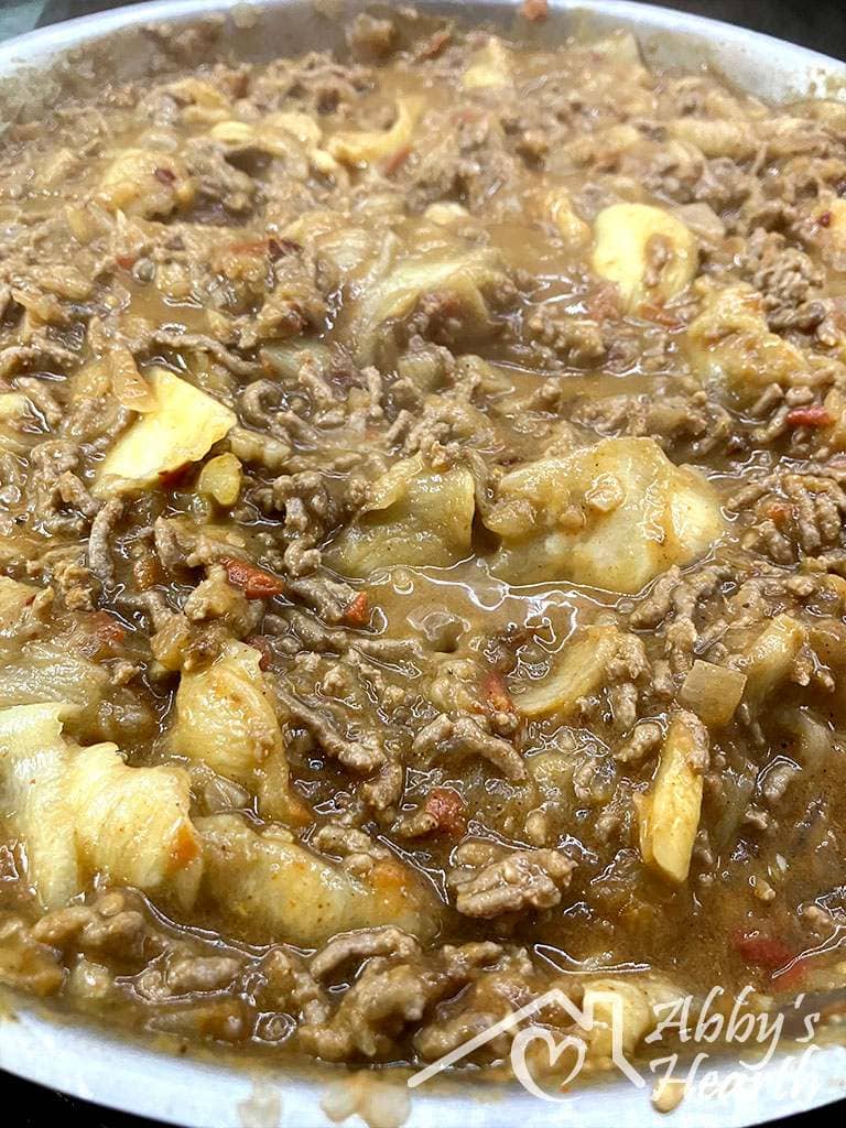 Cooked mince with cabbage leaves in it.