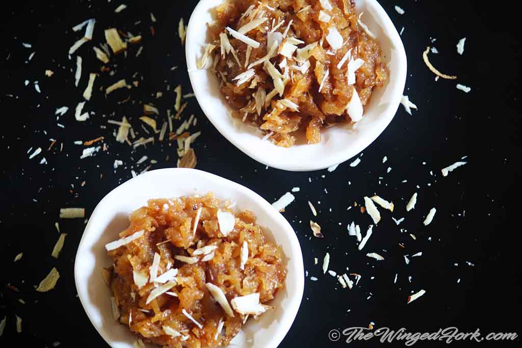 Apple halwa in white bowls.