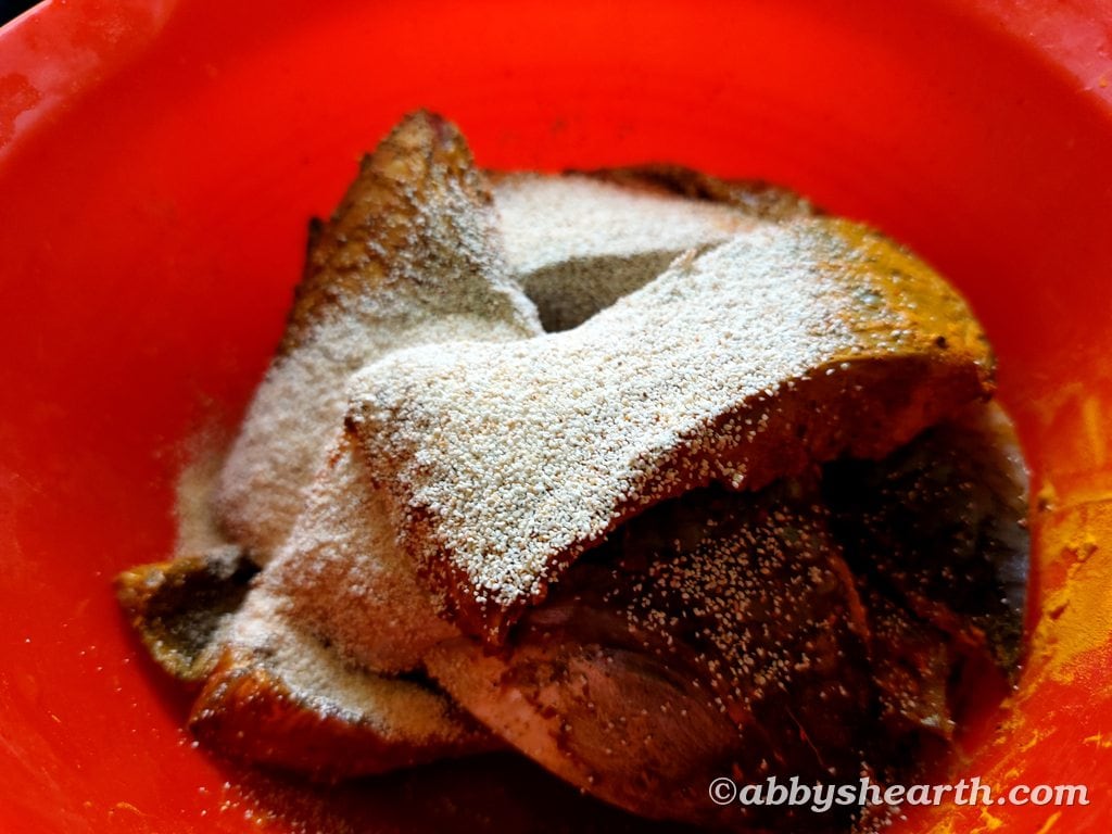 Semolina on top of the marinated fish.