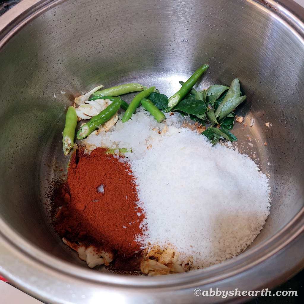 Add masala, coconut and salt to the pot.