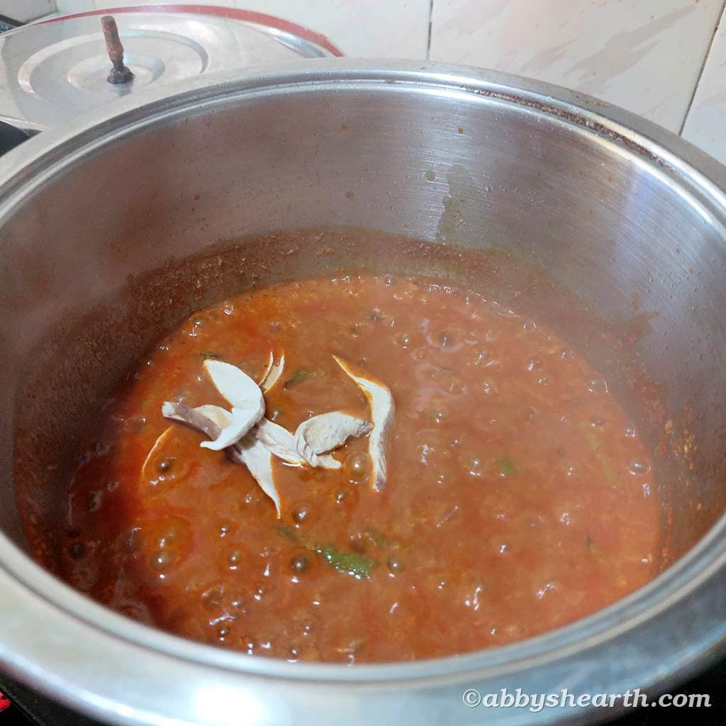 Amboshi (sun dried mango) pieces added to the curry.