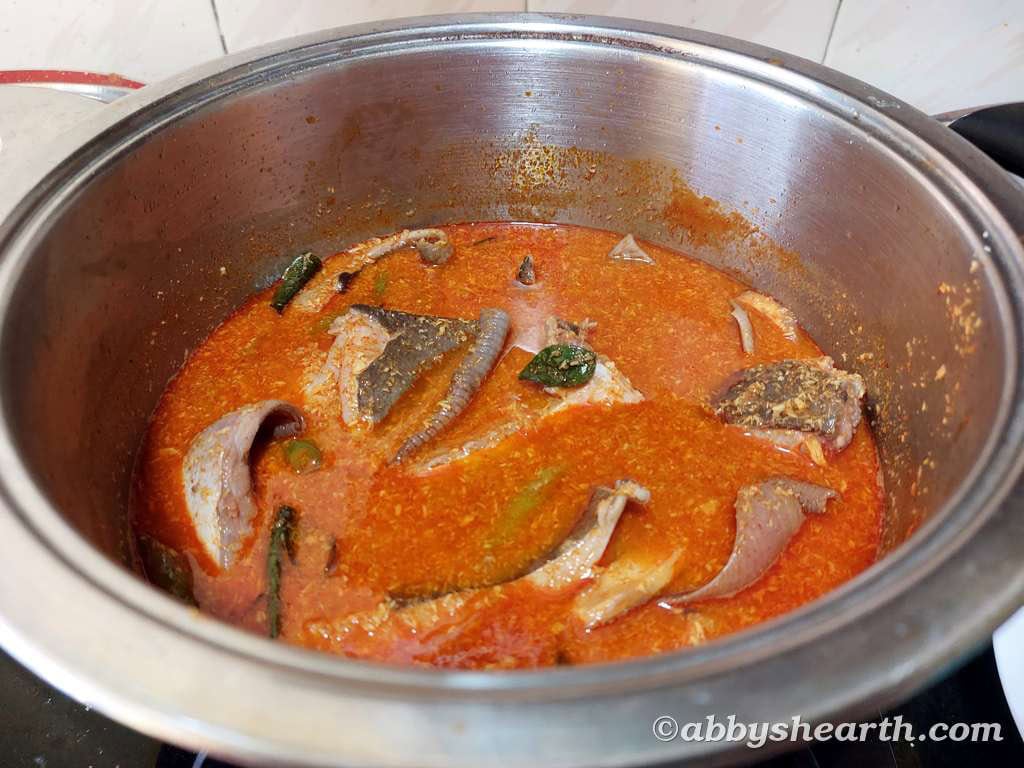 Ray fish curry cooking on a high flame.