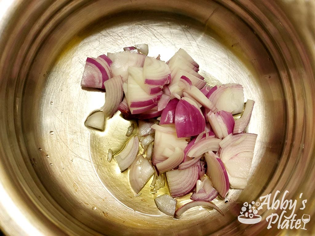 Chopped onions and oil in a pot.