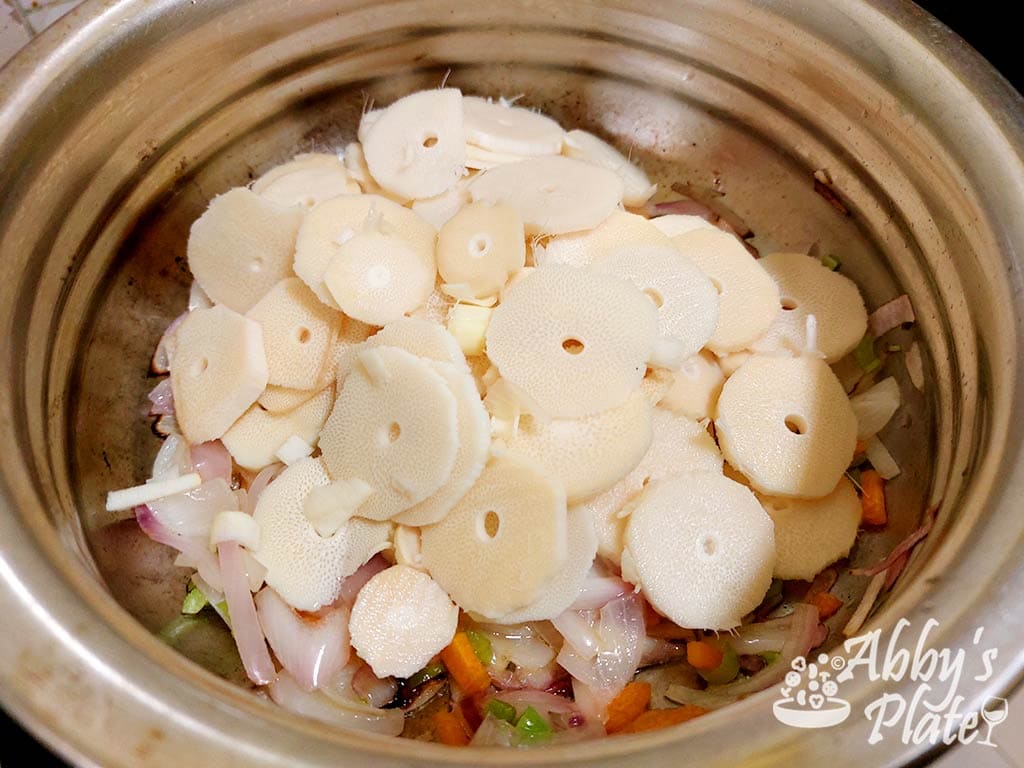 Bamboo shoot slices on top of stir fried veggies.