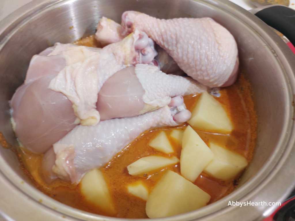 Add the potato cubes and chicken.