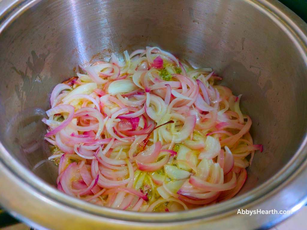 Cook the onions in ghee.