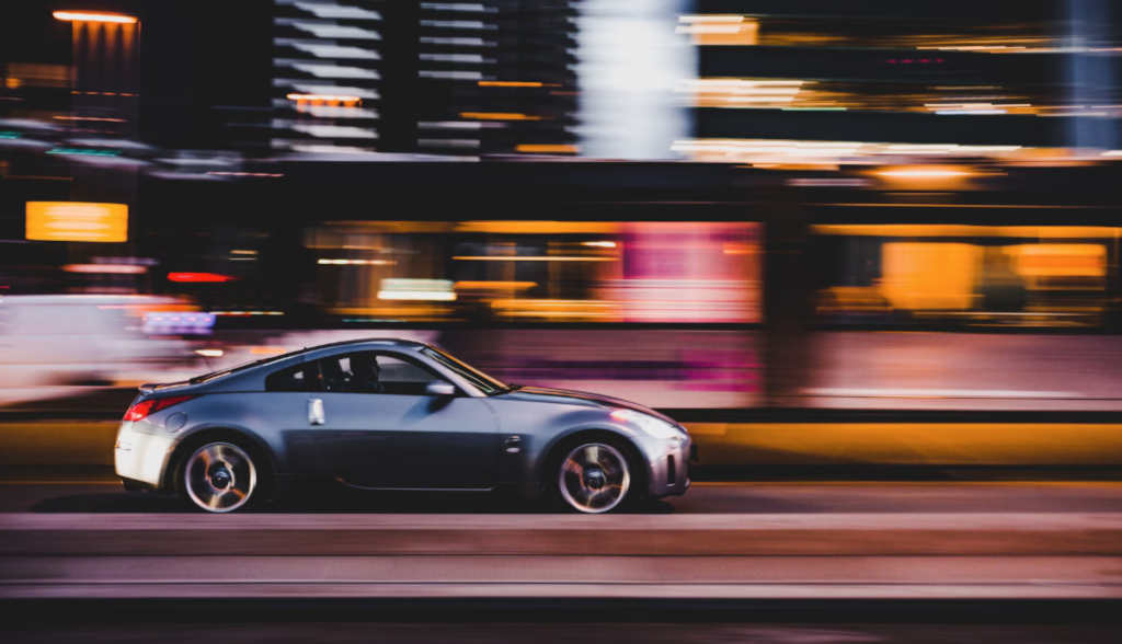 A speeding cadillac coupe.