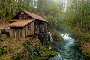 Wooden cabin by a river.