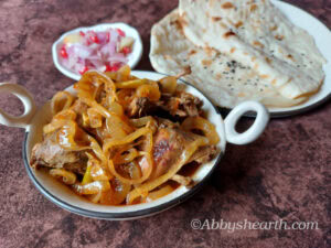 Serve the moile curry with roti and salad.