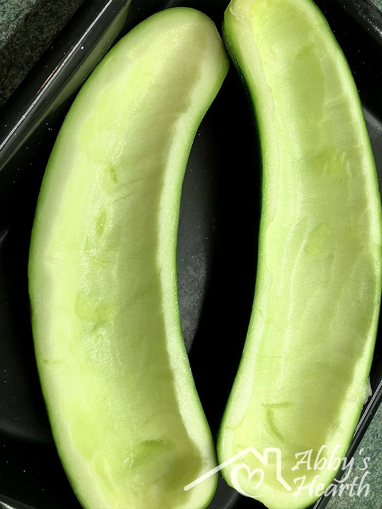 The hollowed out curved zucchini boat halves.