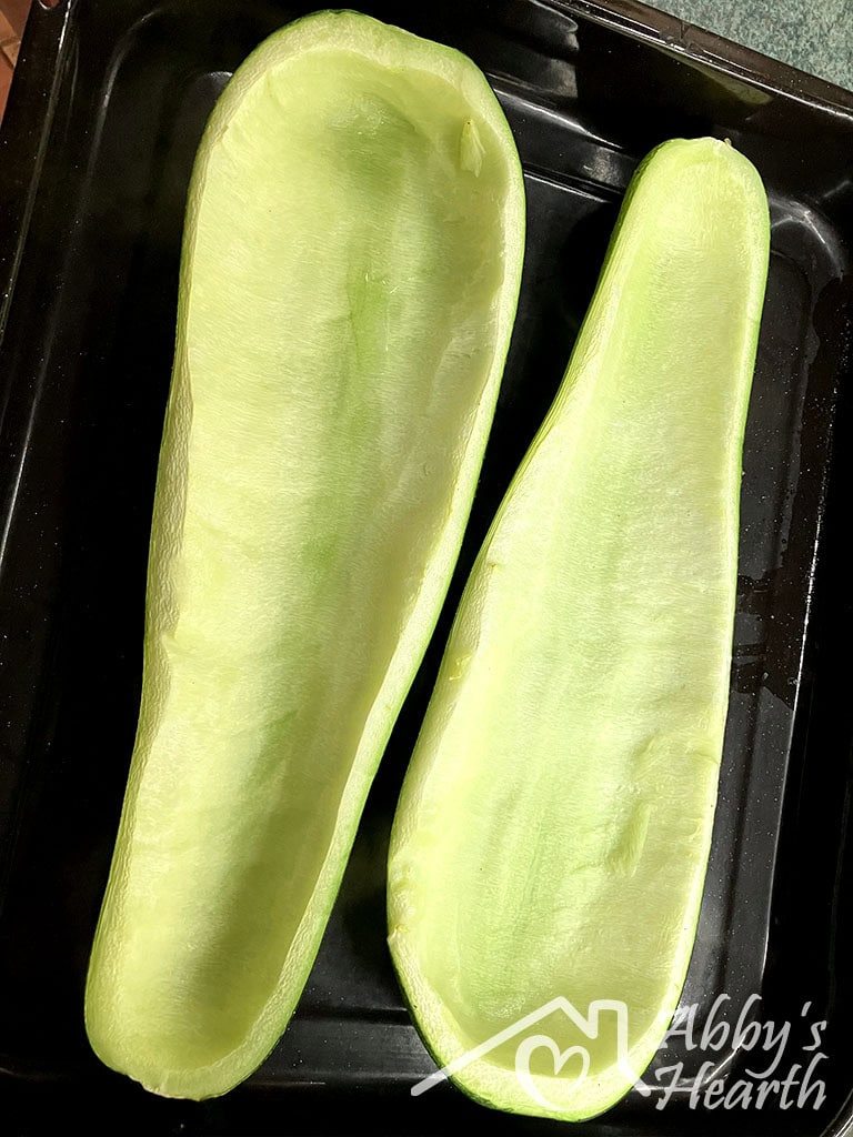 A scooped out zucchini zucchini.