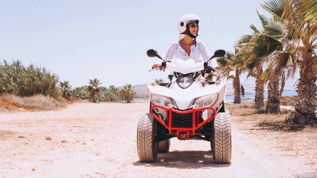 lady offroading on a quad bike.