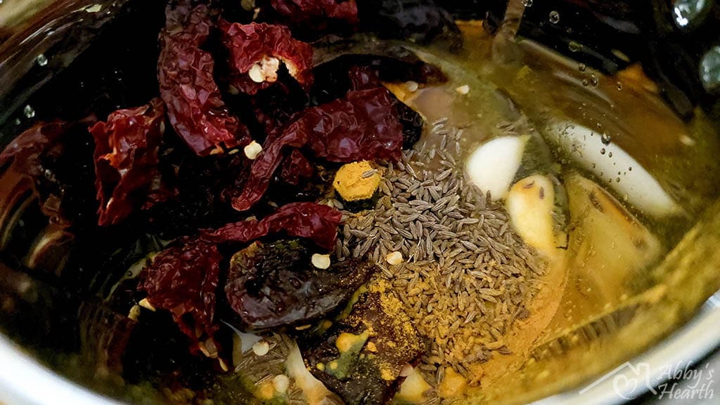 Vindaloo masala ingredients in the grinder.