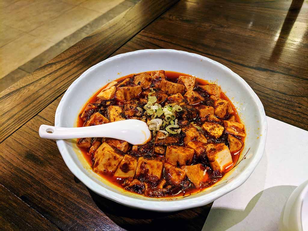 Chinese Mapo Tofu in a white bowl in Chengdu.