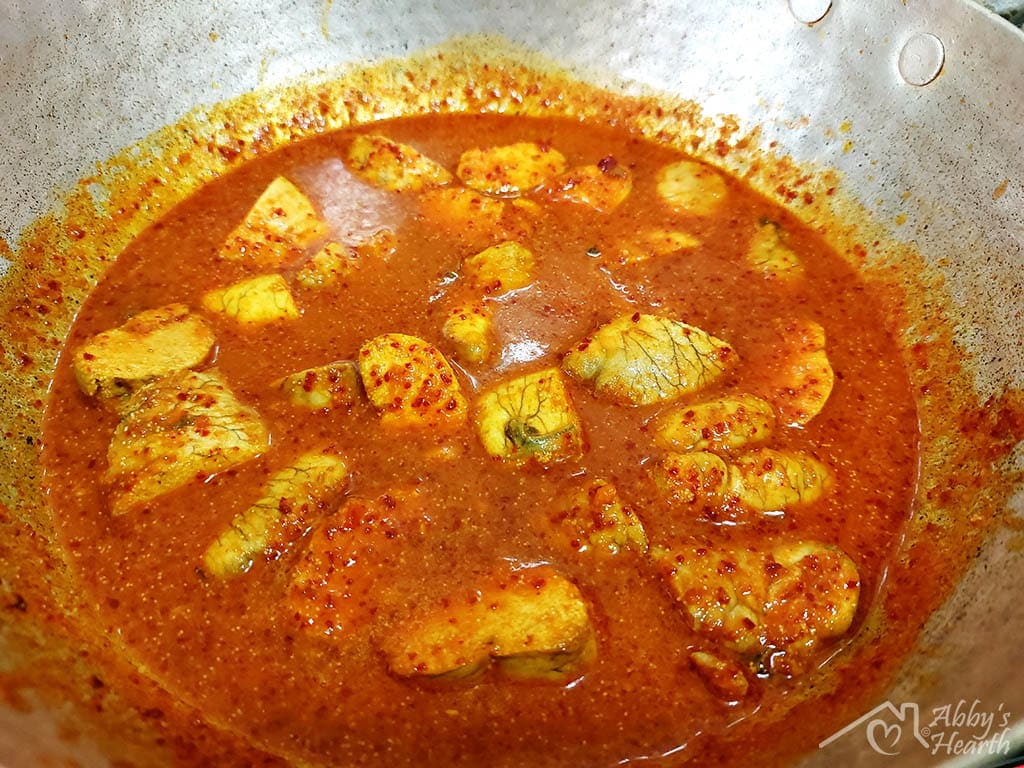 Gaboli vindaloo bubbling and cooking in a kadai.