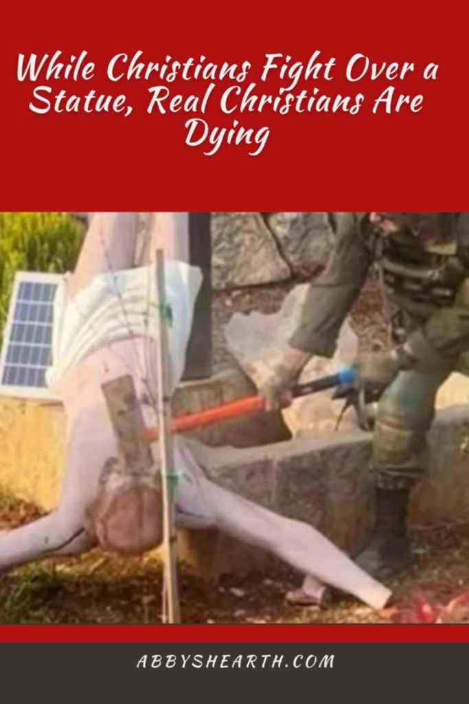 An IDF soldier destroys a statue in Lebanon.