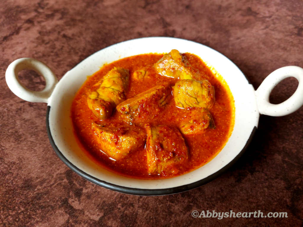 Roe vindaloo curry in a beige dish.