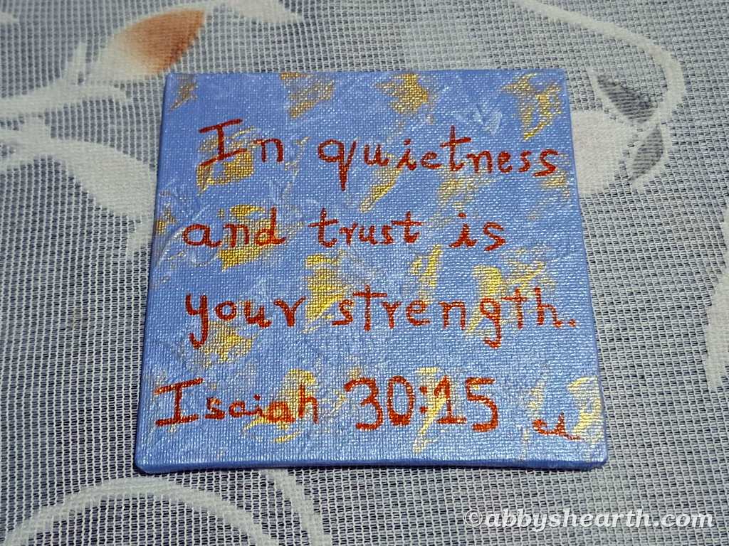 Canvas art with text "In quietness and trust is your strength Isaiah 30:15".