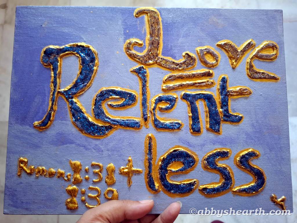 Words "Love = Relentless" on blue backgrou.d with Romans 8:38-39