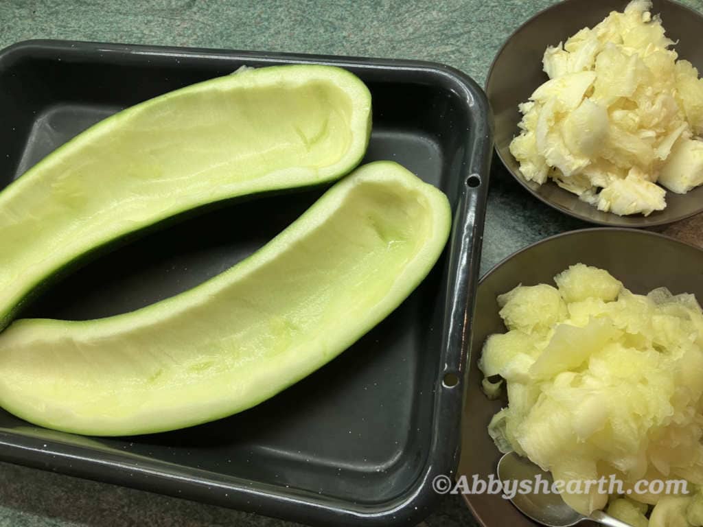 Curved zucchini with the centers scooped out.