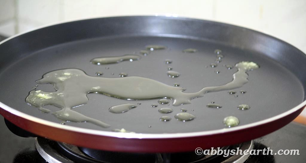 Ghee heating on a frying pan.