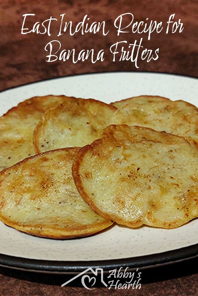 Banana fritters in a beige plate.
