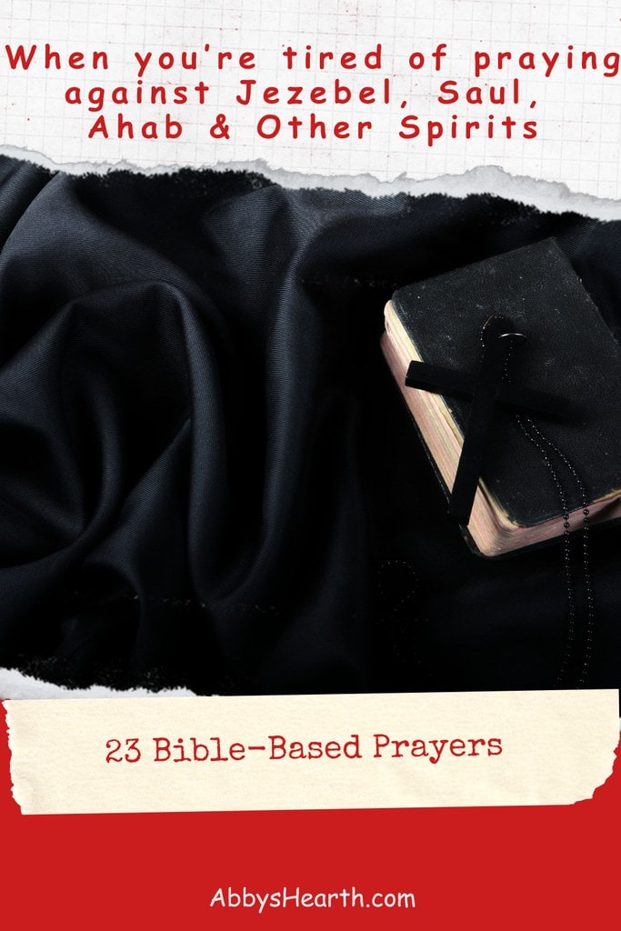 Open Bible with black cross on a black fabric background.