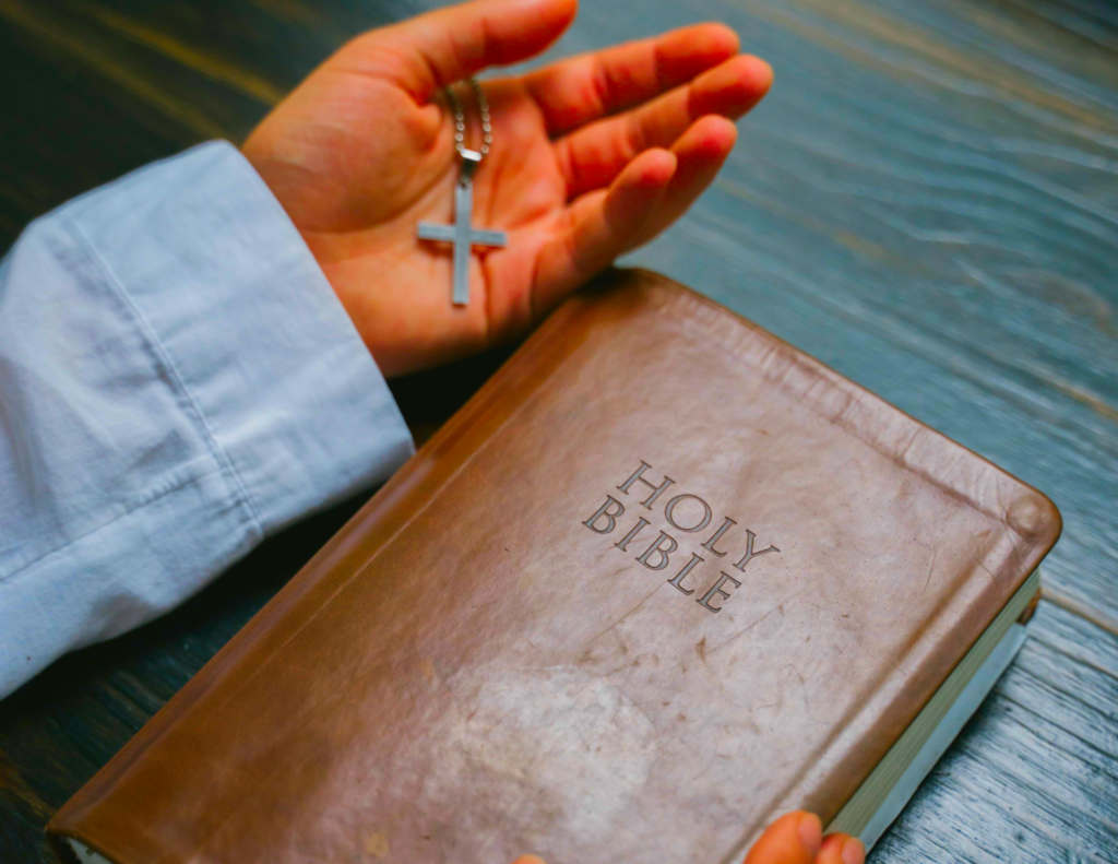 Hand with Bible.