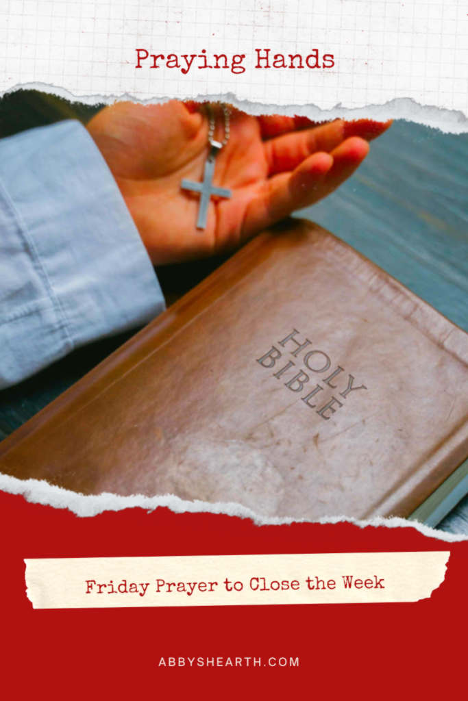 Hand with Bible and rosary.