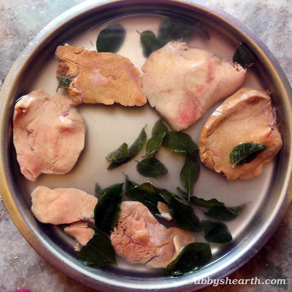 Ray fish liver and curry leaves soaking in water.