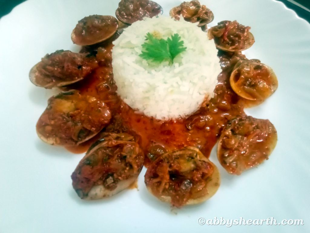 Top view of cockle curry with white rice.