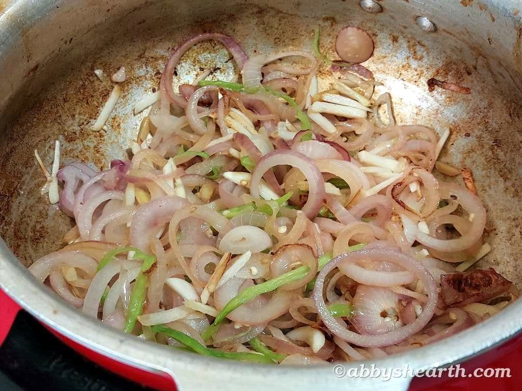 Browned onions ring and chillies.