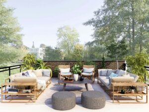 Backdoor seating area with chairs, tables and ottomans.