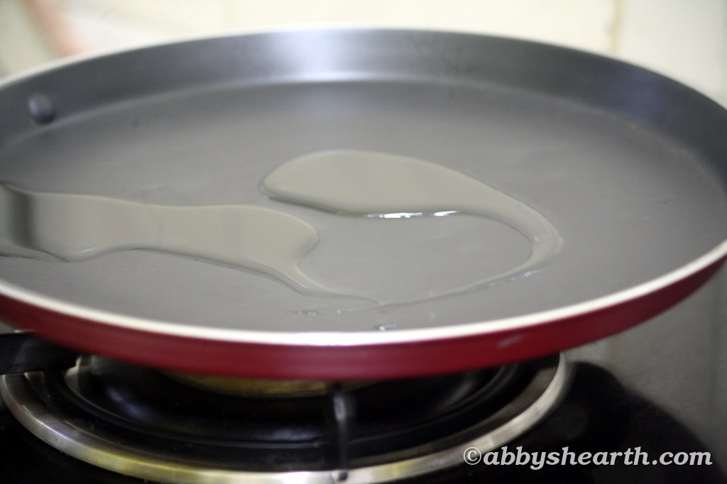 Oil in a frying pan on a stove.