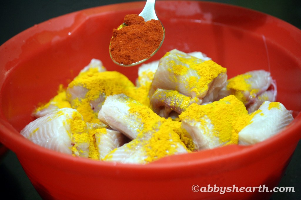 Raw shark fish with turmeric and red chili powder.