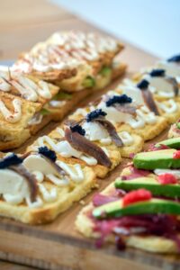 Spanish Pinxtos lined on a platter.