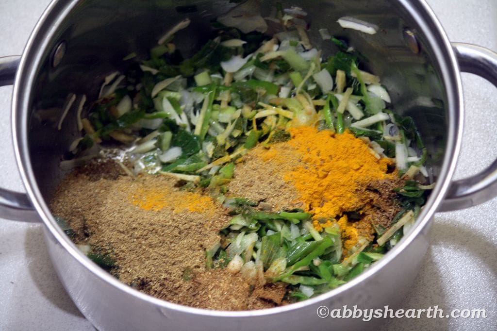 Add cumin, coriander, and turmeric powder.