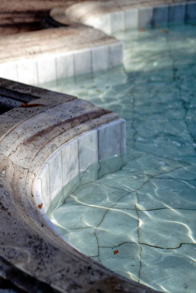 Pool tiles and coping looking old.