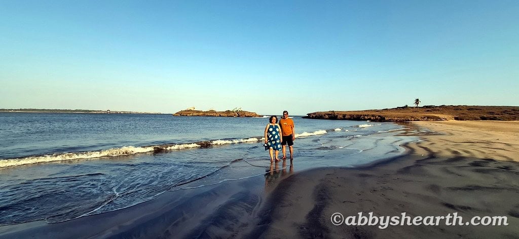 Family walking on the beach during sunset in Diu with senior parents.