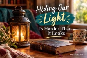 Warmly lit lantern, Bible, and mug with inspiring quote about light.
