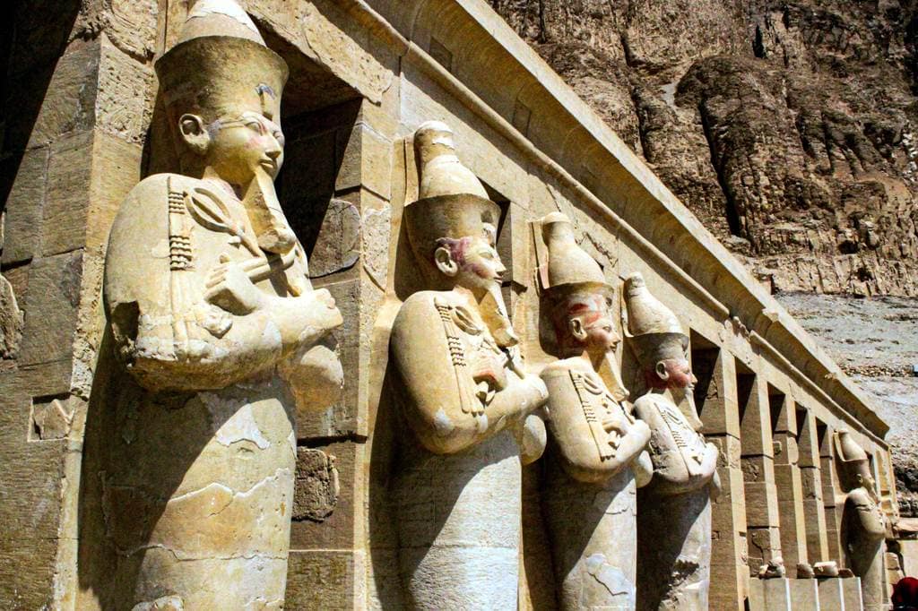 Row of ancient Egyptian statues at Luxor Temple in Egypt.